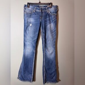 Silver Jeans Women’s Twisted Bootcut W28/L33 Blue light distressing